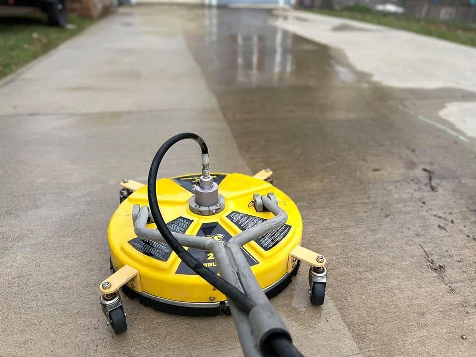 Surface cleaning of concrete driveway Surface cleaning of concrete driveway